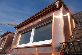 Dormer cladding in standing seam system out of copper