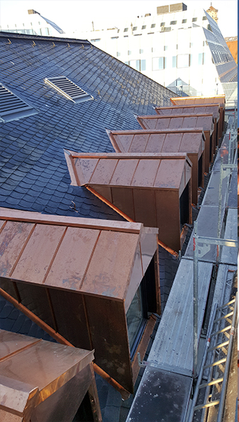 Cladding of 28 dormers out of copper in standing seam system and general plumbing work