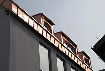 Dormer cladding in standing seam system out of copper