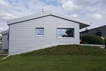 Residential house facade shaped with metal panels from Dangel