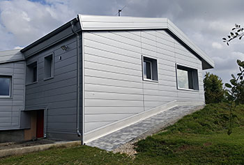 Residential house facade shaped with metal panels from Dangel